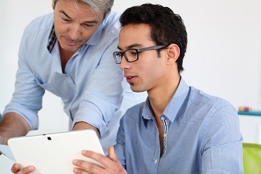 Two people collaborating at a desk